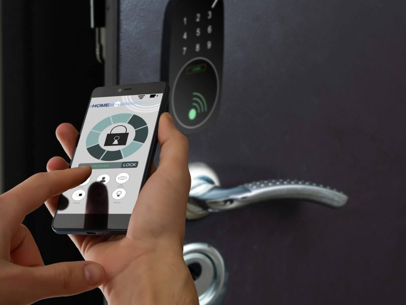 smart-house-home-automation-device-with-app-icons-man-uses-his-smartphone-with-smarthome-security.jpg